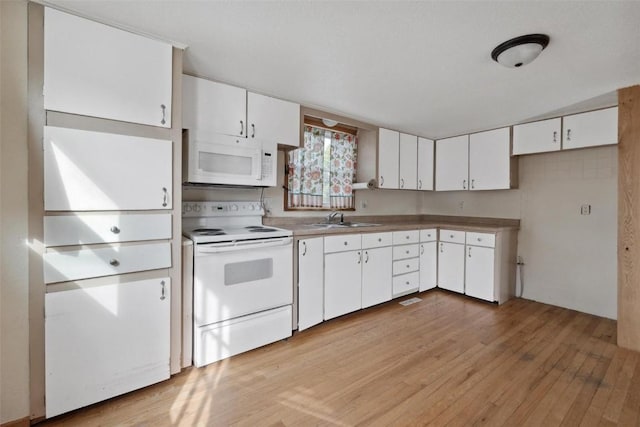 kitchen with white cabinetry, light wood-type flooring, white appliances, and sink