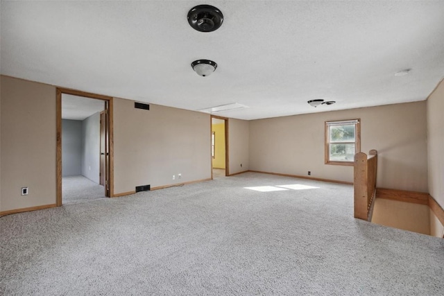 unfurnished room with light colored carpet