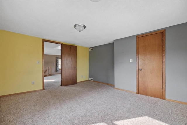 empty room featuring carpet flooring