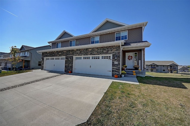 view of front facade featuring a front yard and a garage