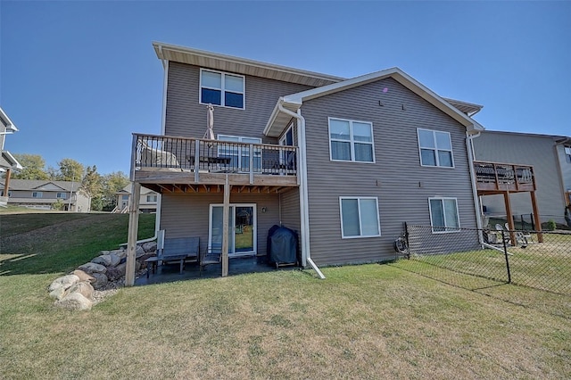 rear view of house with a lawn