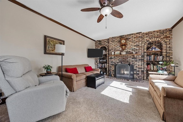 carpeted living room with ceiling fan, crown molding, and a brick fireplace