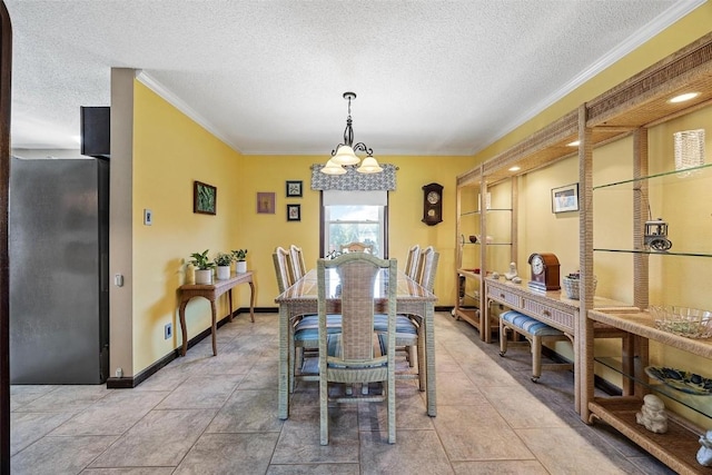 dining space featuring a textured ceiling and ornamental molding