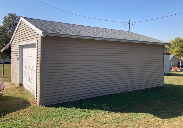 view of outdoor structure with a lawn