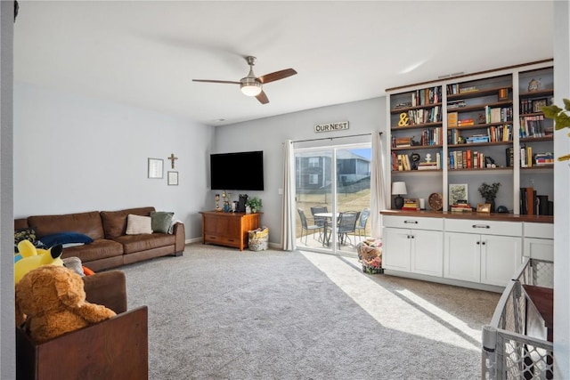 living room with carpet and ceiling fan