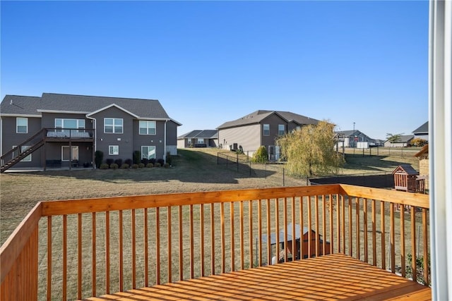 wooden terrace with a yard