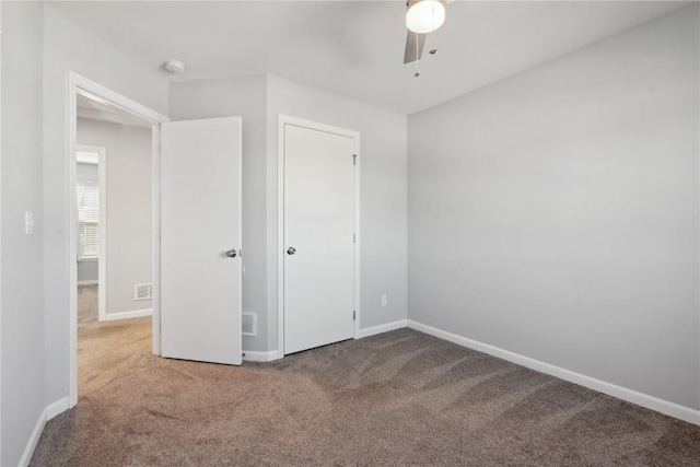 unfurnished bedroom featuring carpet flooring and ceiling fan