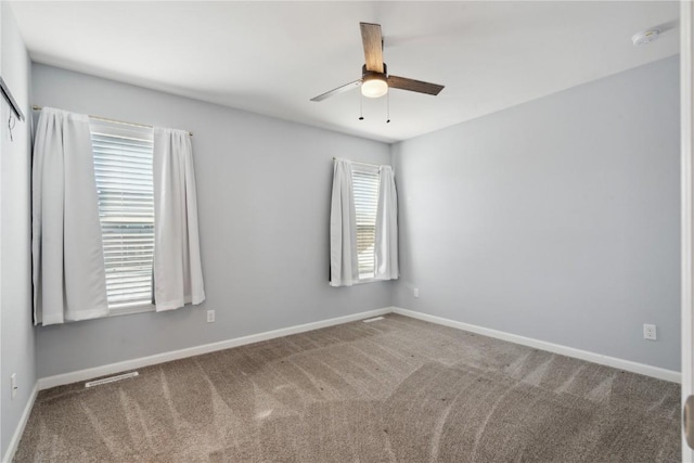 carpeted empty room with ceiling fan