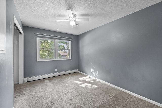 unfurnished bedroom featuring carpet floors, ceiling fan, a baseboard radiator, and a textured ceiling