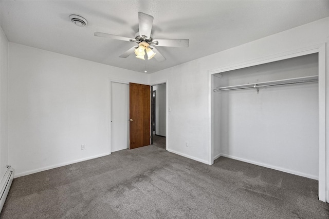 unfurnished bedroom featuring dark colored carpet, ceiling fan, a closet, and baseboard heating