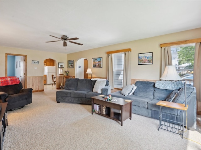 living room with ceiling fan and light carpet