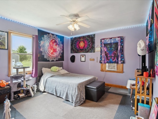 bedroom featuring cooling unit, ceiling fan, and carpet