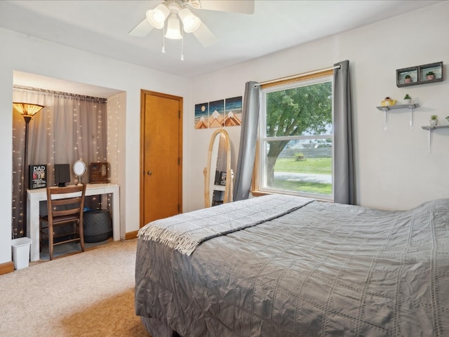 carpeted bedroom featuring ceiling fan