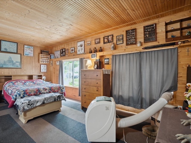 carpeted bedroom with wood ceiling and wooden walls