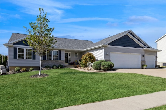 ranch-style home with a garage and a front lawn