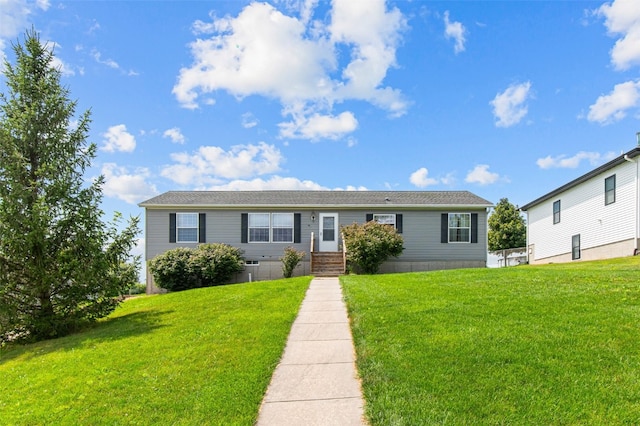 view of front of home with a front lawn