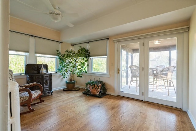 sunroom featuring plenty of natural light and ceiling fan