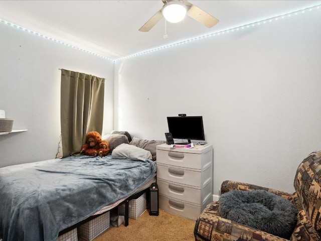 bedroom with ceiling fan and light colored carpet