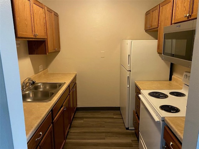 kitchen with dark hardwood / wood-style floors, sink, and white electric range