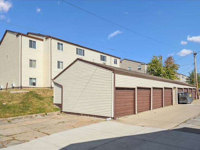 garage featuring a lawn