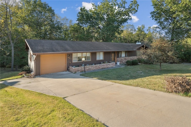 single story home with a garage and a front lawn