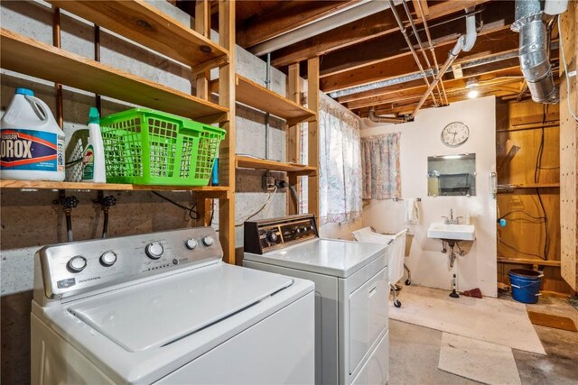 laundry room featuring washer and dryer and sink