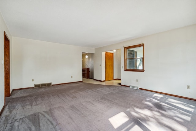 unfurnished room with light colored carpet