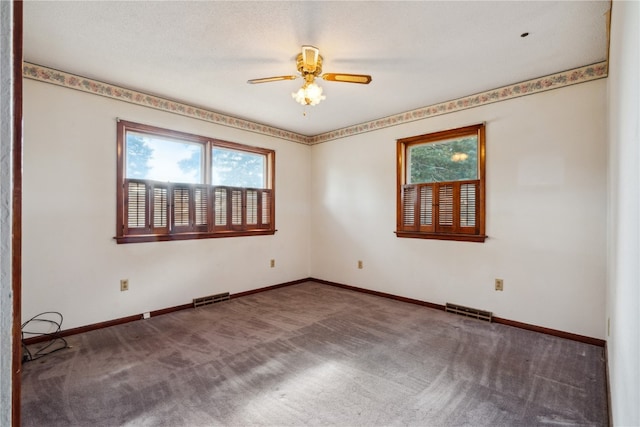 unfurnished room featuring carpet floors and ceiling fan