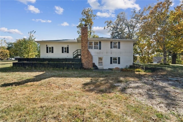 back of house featuring a yard