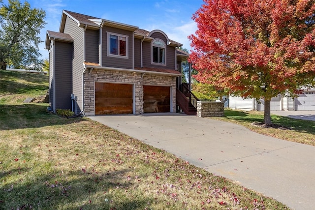 view of front of property with a front lawn and a garage