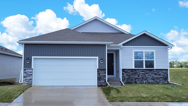 craftsman-style house featuring a garage and a front lawn