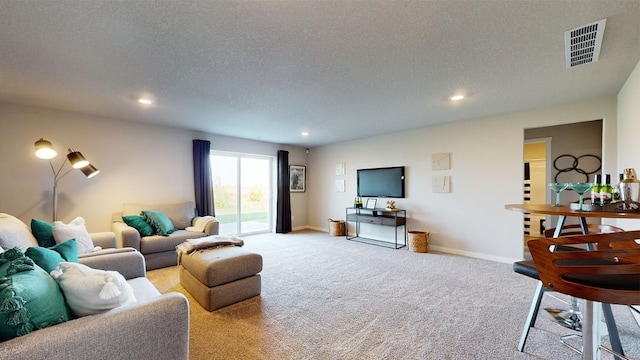 2729 Prairielight Dr, Hiawatha, IA 52233 - carpeted living room featuring a textured ceiling, recessed lighting, and baseboards