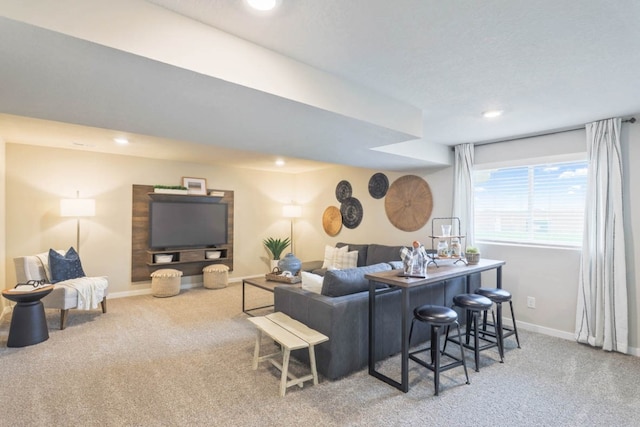 carpeted living room featuring bar