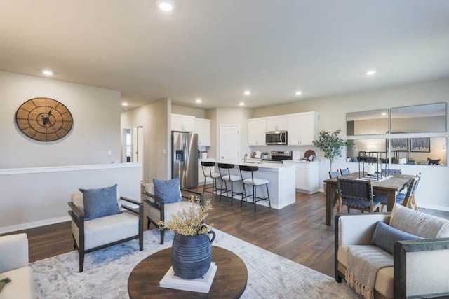 living room with dark hardwood / wood-style floors