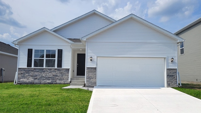 view of front of home featuring a garage and a front lawn