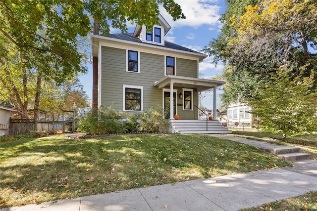 view of front of house with a front yard and a porch