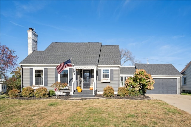 view of front of property with a garage and a front lawn