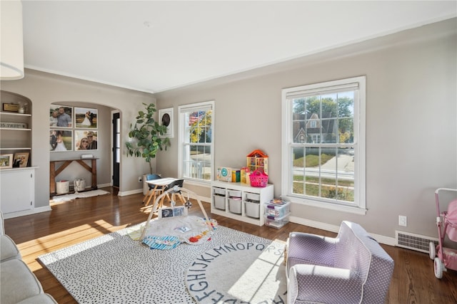 playroom with dark hardwood / wood-style floors