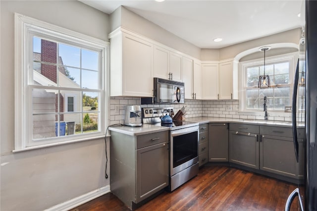 kitchen with white cabinetry, stainless steel range with electric stovetop, dark hardwood / wood-style floors, and gray cabinets