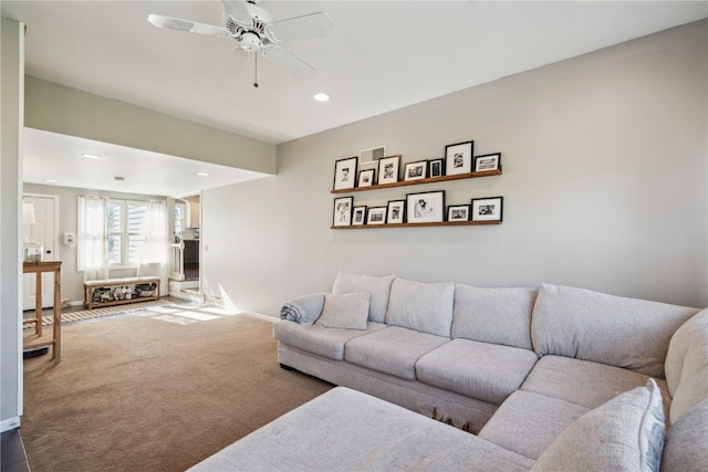 living room featuring carpet flooring and ceiling fan