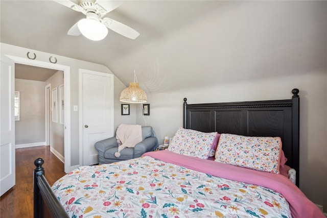 bedroom featuring lofted ceiling, dark hardwood / wood-style floors, and ceiling fan