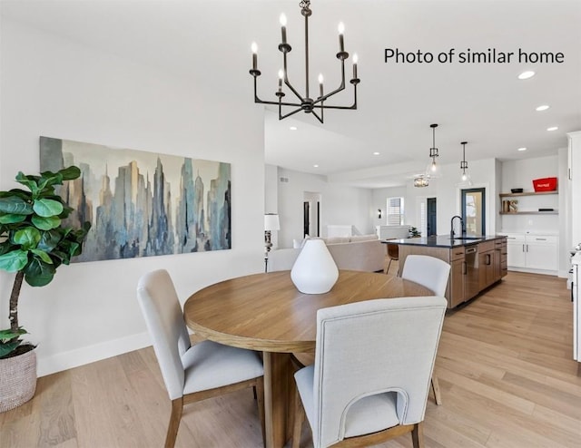 dining area with light wood finished floors, baseboards, and recessed lighting