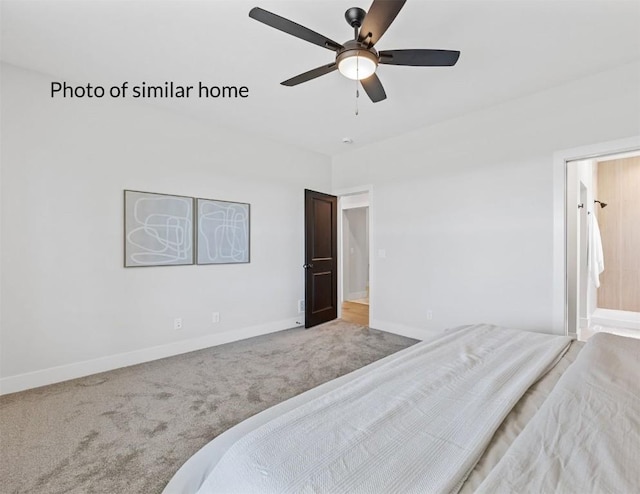 carpeted bedroom with ceiling fan and baseboards