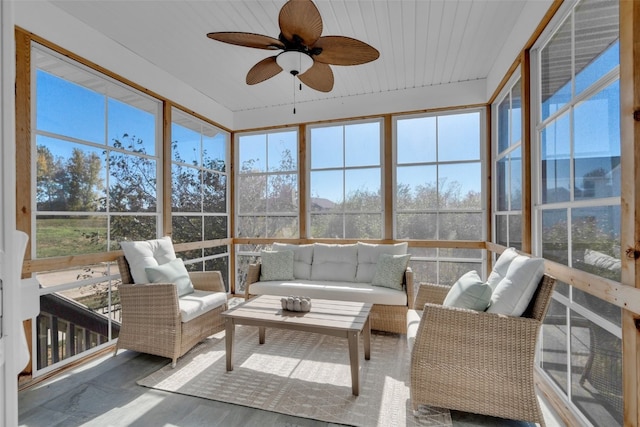 sunroom with wooden ceiling and ceiling fan