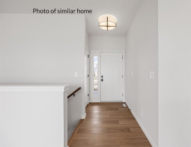 entrance foyer featuring hardwood / wood-style flooring