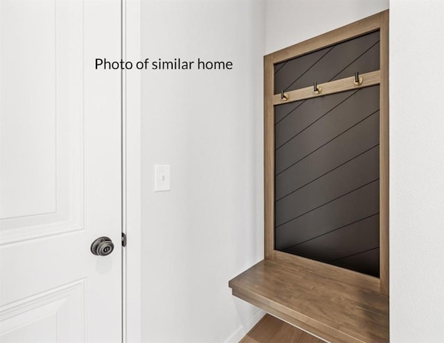 mudroom with hardwood / wood-style floors