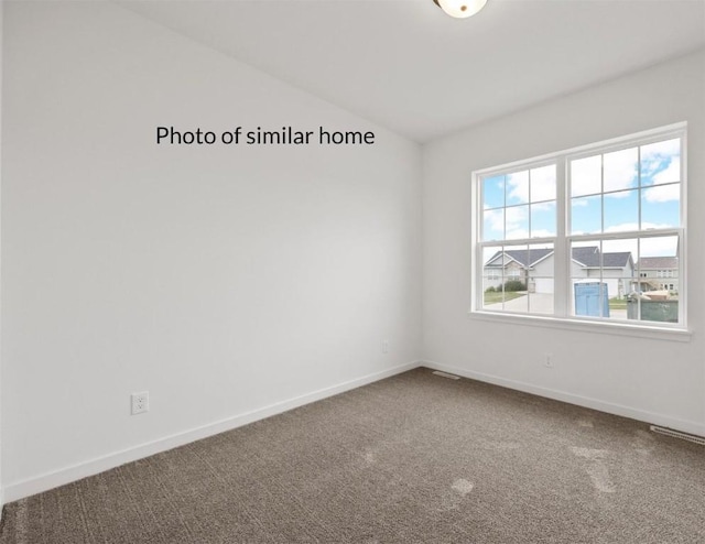 view of carpeted spare room