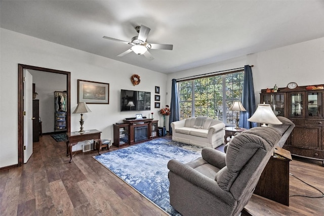 living room with hardwood / wood-style flooring and ceiling fan