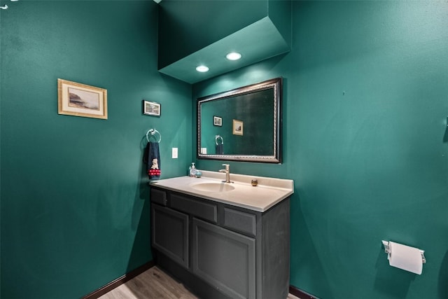 bathroom featuring vanity and hardwood / wood-style flooring