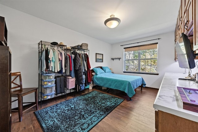 bedroom with hardwood / wood-style floors